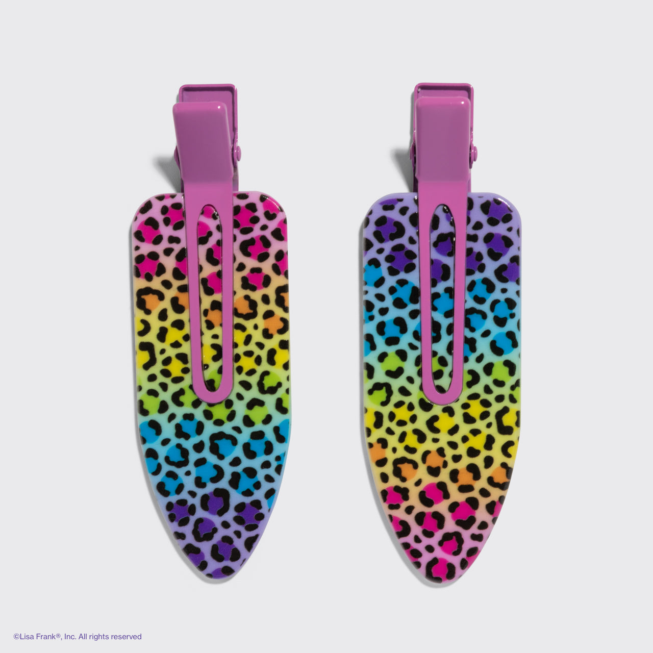 Lisa Frank x Kitsch XL Creaseless Clips in Rainbow Leopard, two colorful leopard print hair clips with pink clips on a gray background