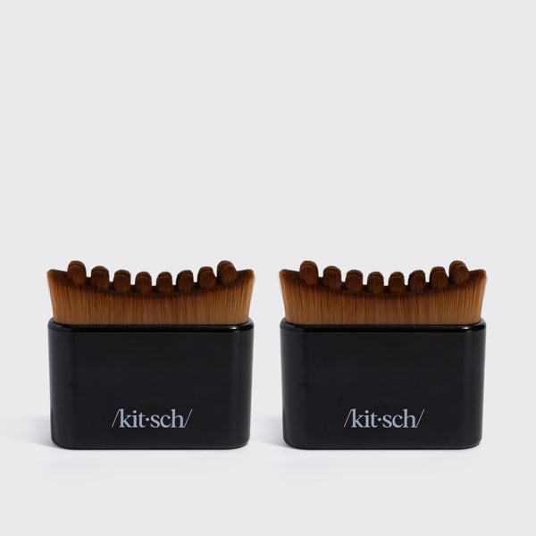Two black KITSCH Lymphatic Contour Face Brushes, front-facing packaging shot