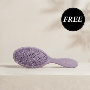 Kitsch Soft Violet Wet/Dry Brush shown with its retail packaging, flexible bristles designed to glide through knots and tangles without pulling hair